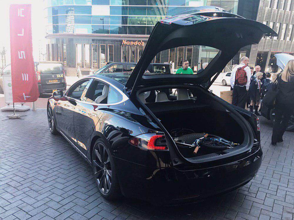 tesla model s and swifty scooters, reducing air pollution, ev and kick scooter