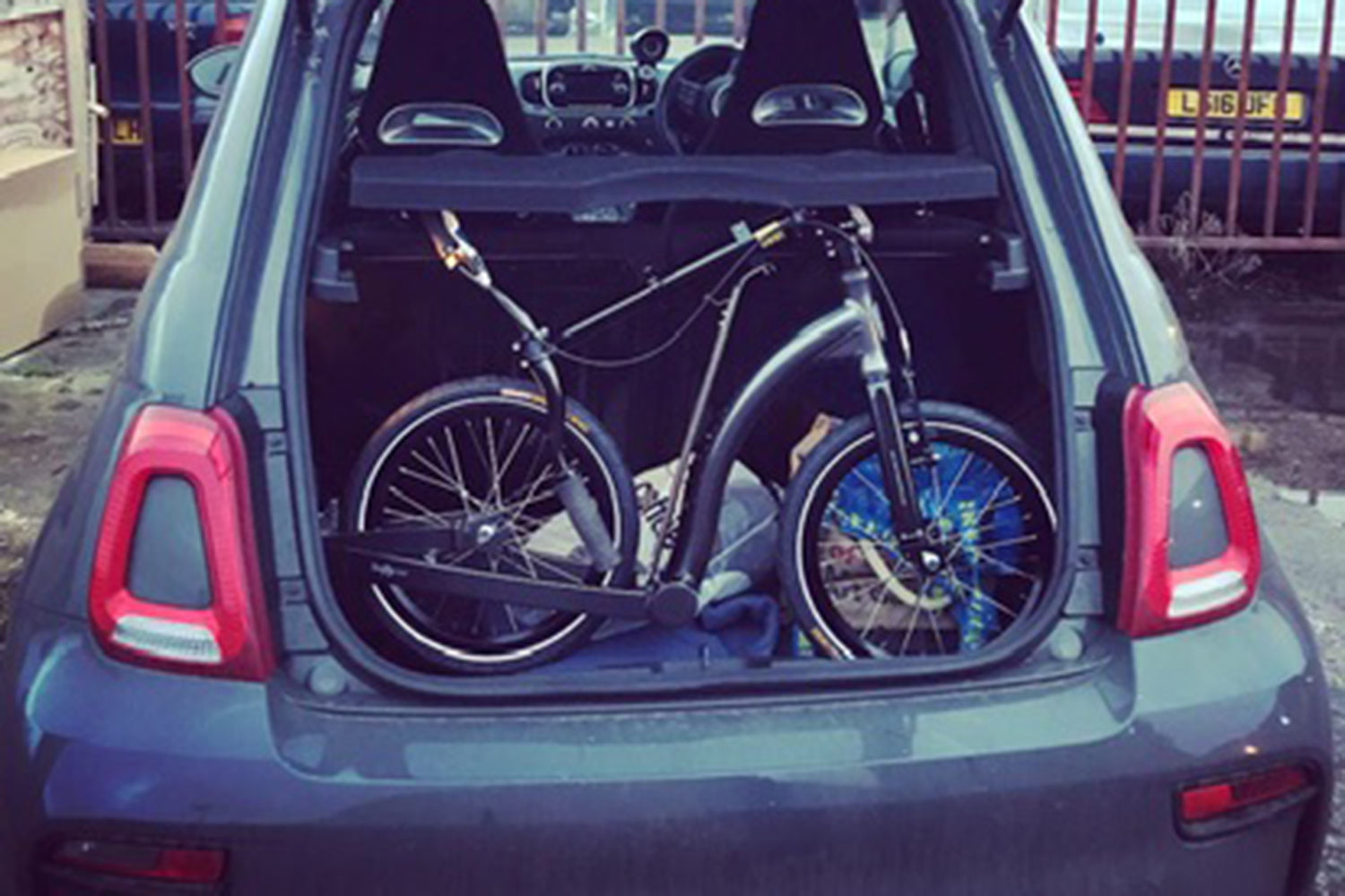 Folding adult commuter scooter in car boot